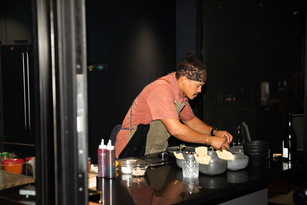 Documentary wedding photography of a private chef cooking a meal