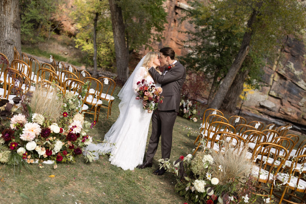 Bride and groom in fall colors at Planet Bluegrass in Lyons, Colorado