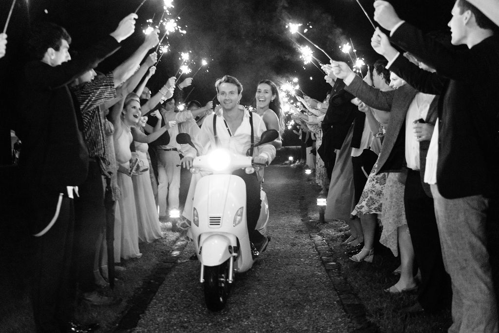 Sparkler send off on a moped after a Magnolia Plantation wedding