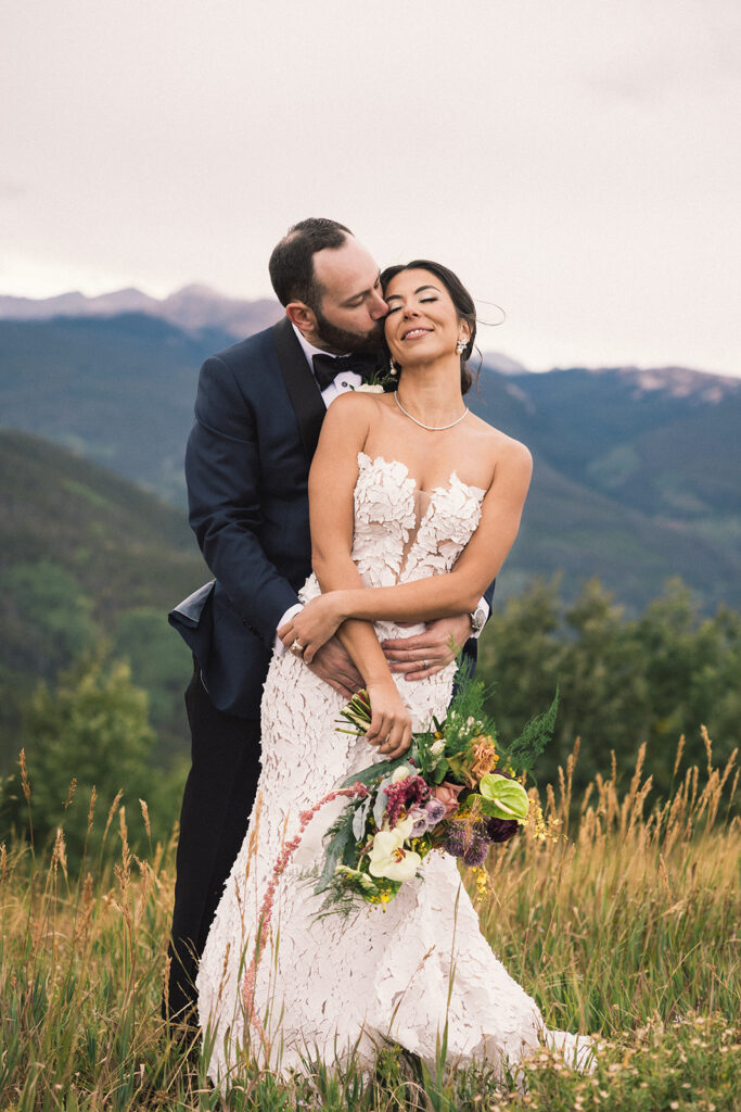 Bride and groom photos on top of Vail Mountain in Colorado