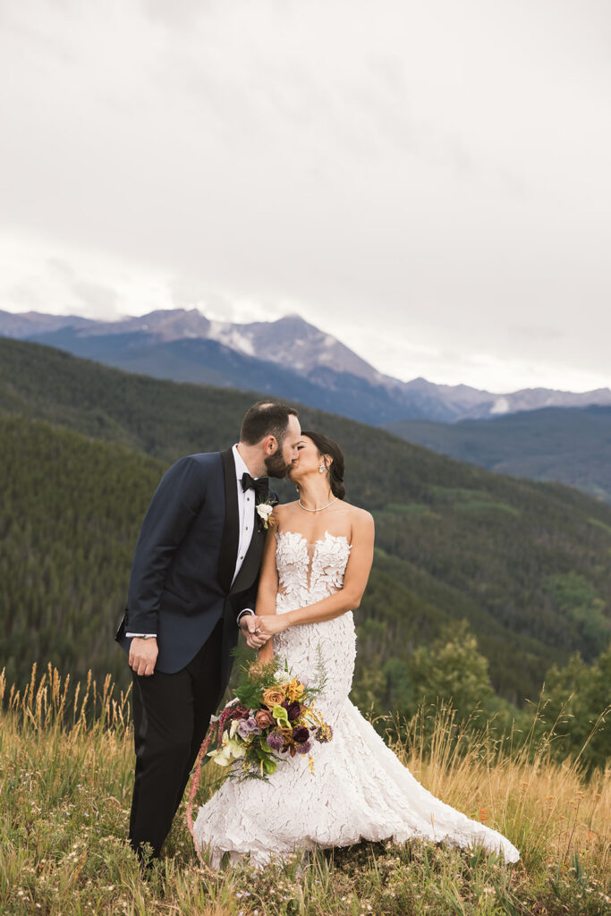 Bride and groom photos on top of Vail Mountain in Colorado