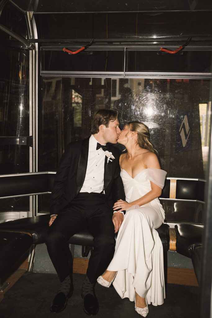 Bride and groom kiss on the gondola